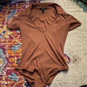 Very cute forever21 body suit. Gently worn no holes rips, or tears. Size small